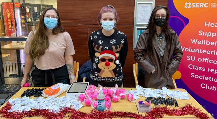 Students behind their stall at the christmas fairs in Lisburn